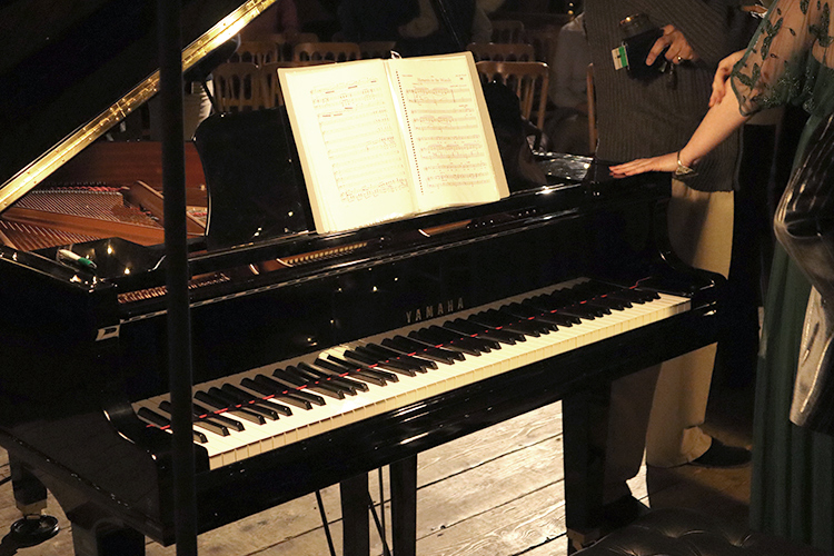 Yamaha With Sheet Music at Dinner Party